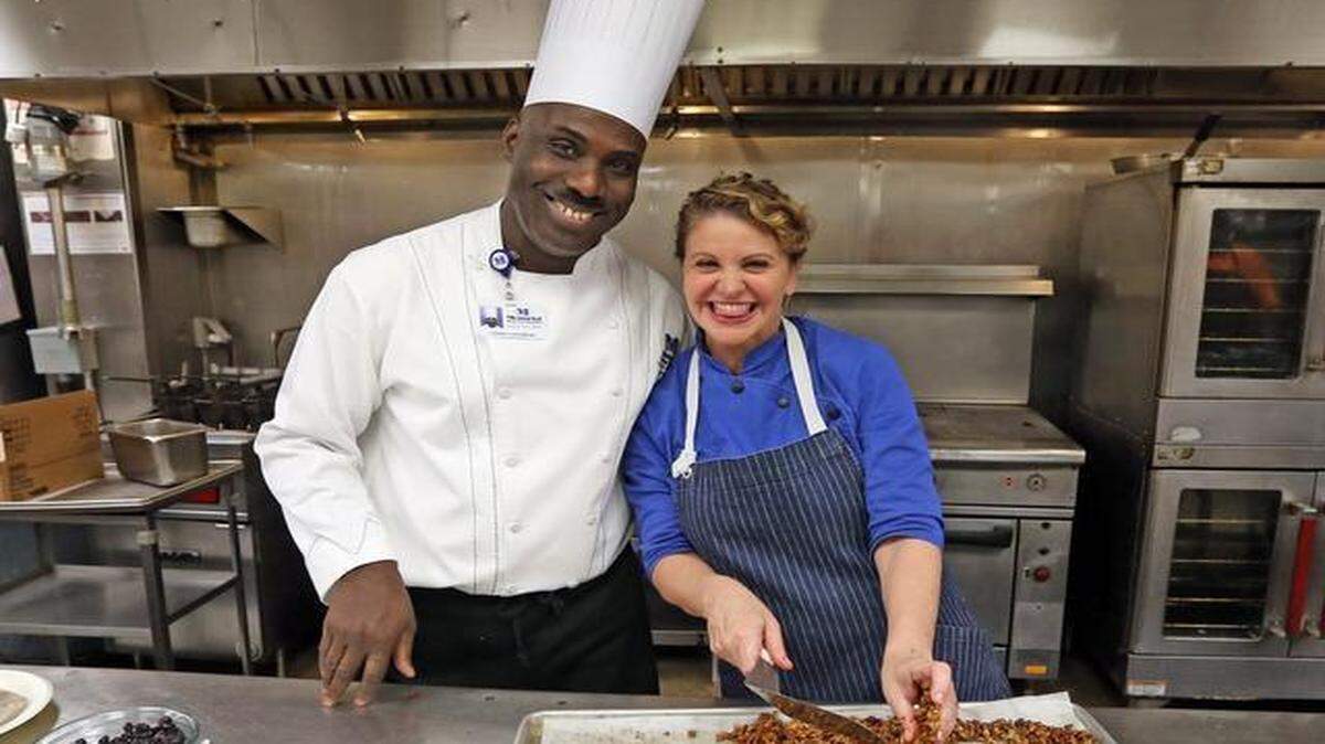 
Memorial Regional Executive Chef Pierre Flerismond and Chef Michelle Bernstein prepare granola at Memorial Regional Hospital in Hollywood to create foods for cancer patients.
