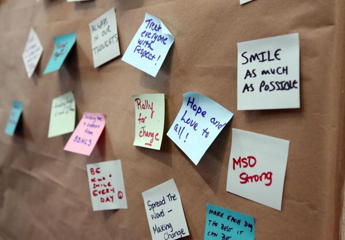 Messages of kindness are stuck to a wall at the Jewish Federation of Broward in Cooper City, Tuesday, Feb. 27, 2018.