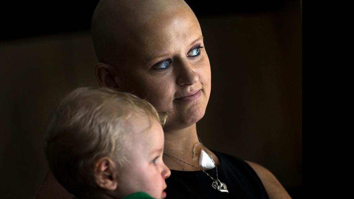 
Jessica Strohauer, 28, holding her 11-month-old son Zach, is fighting for her life after being diagnosed with cancer. Her family and friends have come together to try to raise money to help her care for her children and her medical expenses.
