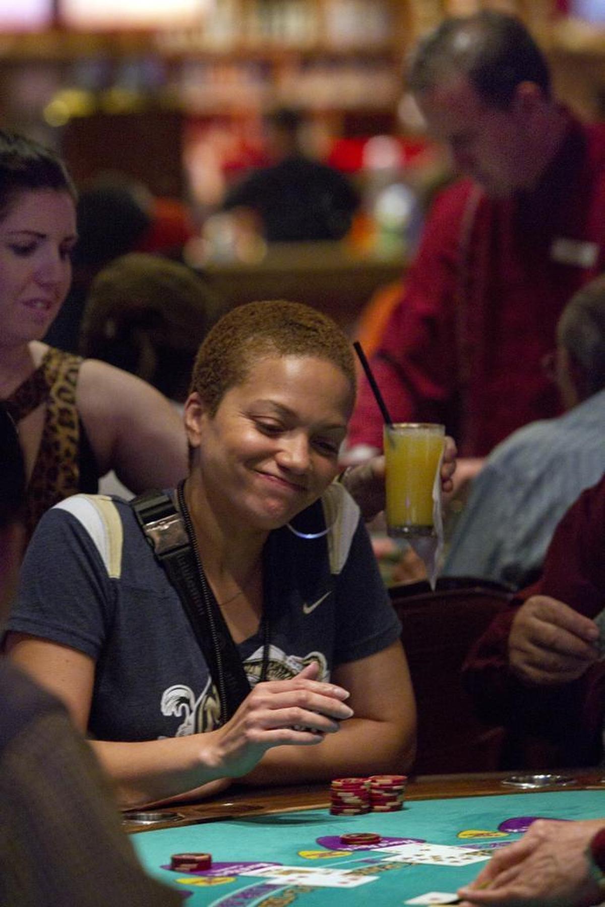 Lisa Johnson of Bel Air, Maryland, watches the dealer deal a blackjack hand at the Seminole Hard Rock Casino in Hollywood, Wednesday June 22, 2011.