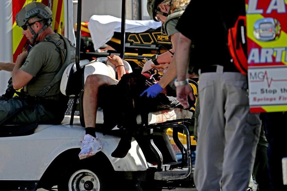 Medical personnel tend to a victim outside of Marjory Stoneman Douglas High School in Parkland after a mass shooting there.