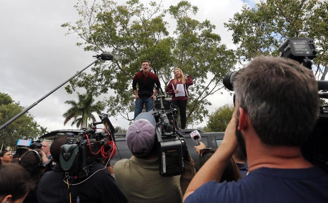 Marjory Stoneman Douglas trip organizers Cameron Kasky and Jaclyn Corin, both juniors talk to the crowd of students ready to board buses to head to Tallahassee on Tuesday.