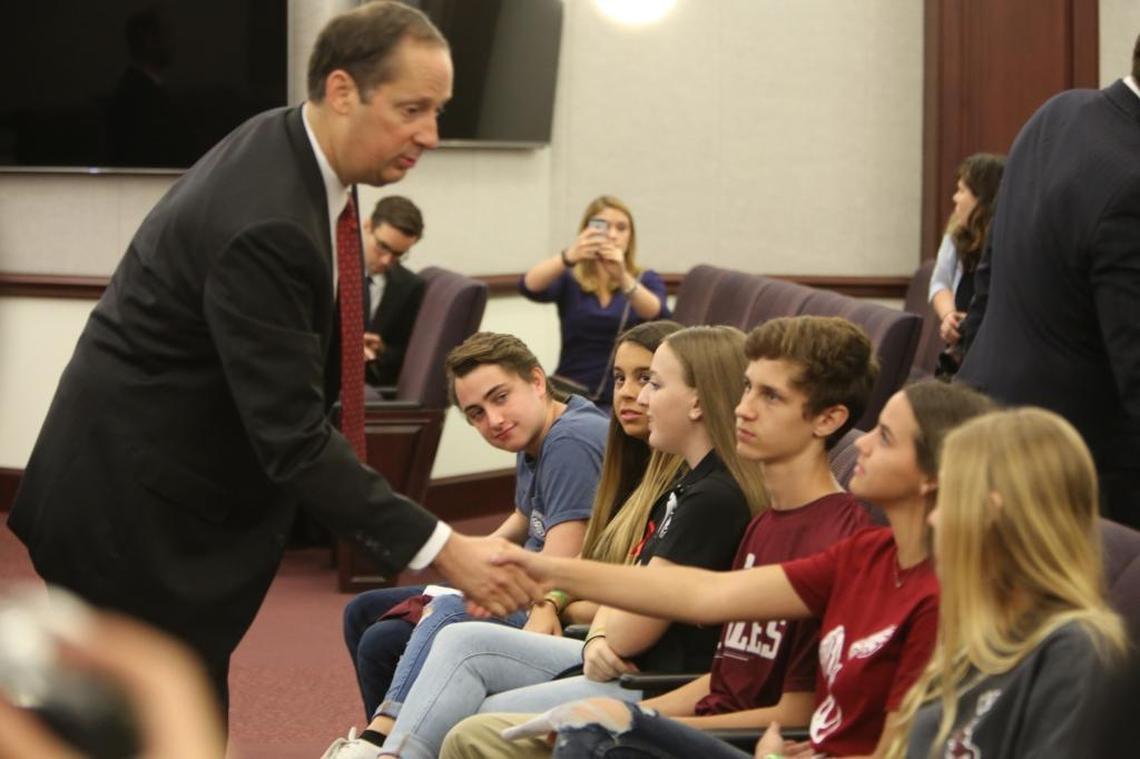 Senate President Joe Negron shakes hands with Marjory Stoneman Douglas students at the Capitol on Wednesday morning.