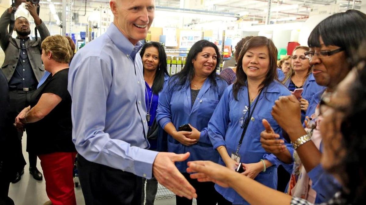 Gov. Rick Scott greets employees at ACR Electronics in Fort Lauderdale at a press conference to announce his proposed tax cuts for the upcoming budget. January 25, 2017.