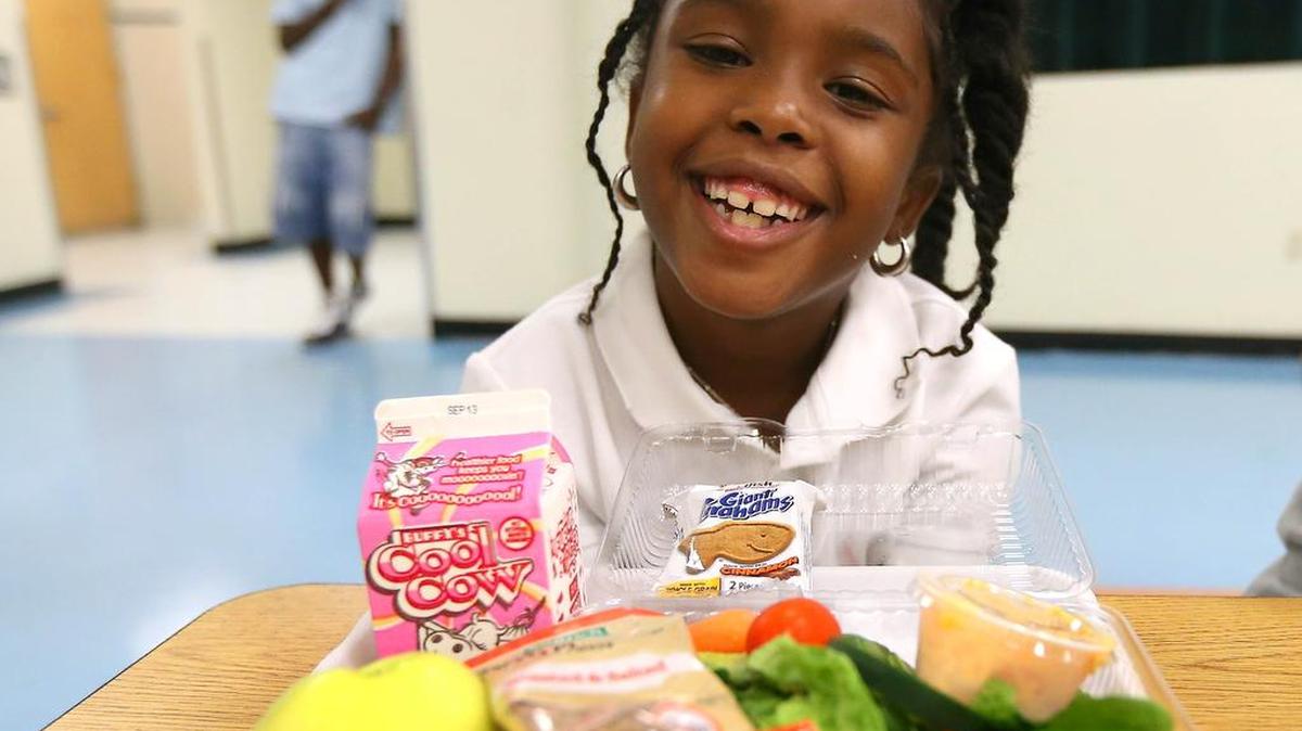 
Second-grader Caylen Rudd, 7, likes to load her lunch try with healthy offerings at Coconut Palm Elementary in Miramar. Miami-Dade and Broward public schools are working to give students healthier lunch options.
