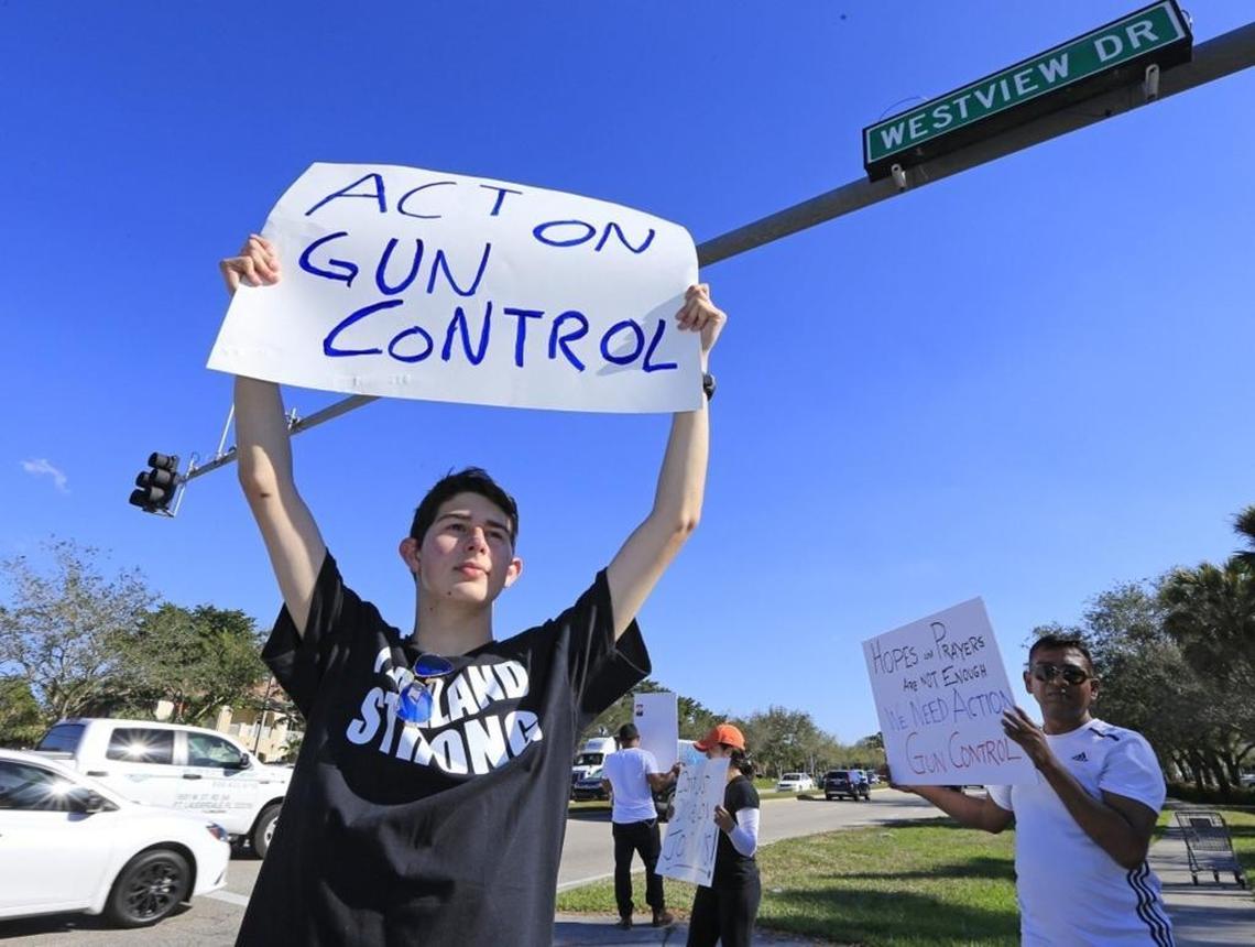 Josh Levine, 17, a student from Marjory Stoneman Douglas High School, stands at the corner of Westview Drive and University Drive, protesting for tighter gun control on Friday, Feb. 16, 2018.