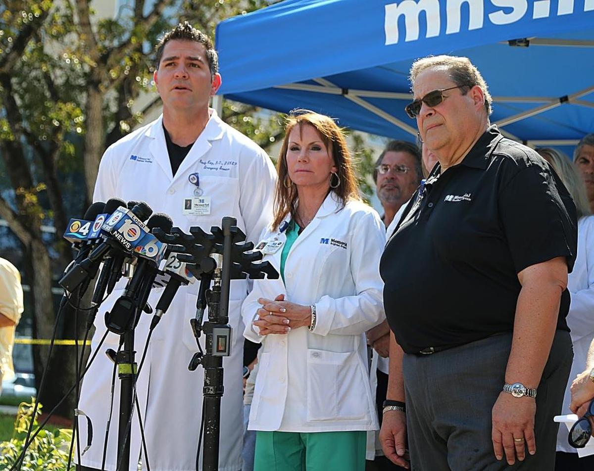 Dr. Randy Katz, Judy Frum, RN, and CEO Zeff Ross, all of Memorial Regional Hospital, talk to media Thursday.