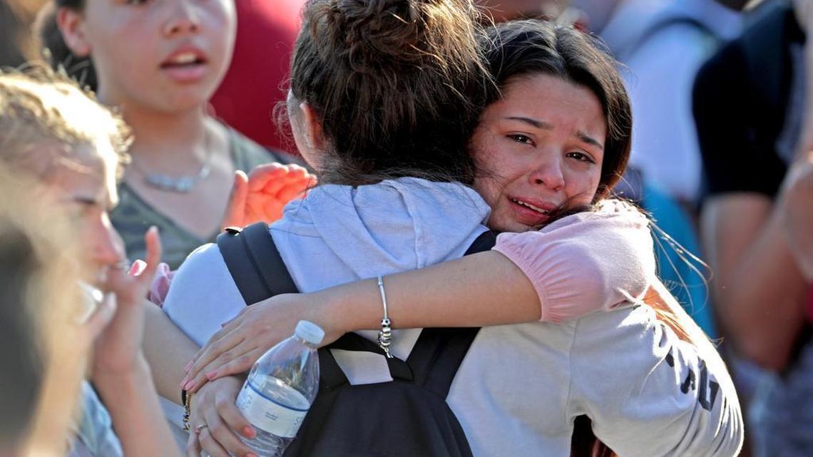 Students are released from a lockdown outside Marjory Stoneman Douglas High School in Parkland after a rampage killed 17 students and educators on Feb. 14, 2018.