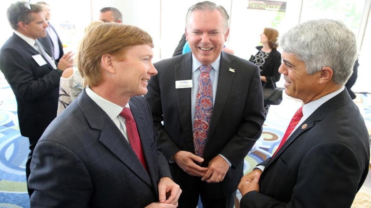 Agriculture Commissioner Adam Putnam speaks with Bob Swindell, with the Greater Fort Lauderdale Alliance, and Jose Basulto, with Memorial Hospital System, as he made his South Florida debut as a candidate for governor at Monday's Greater Fort Lauderdale Alliance Luncheon at Hyatt Regency Pier 66 as part of his 10-day bus tour on May 15, 2017.