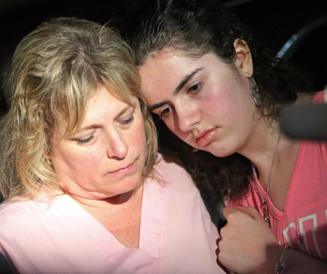 Stacy Crescitelli comforts her daughter, Sarah, 15, after they were finally reunited Wednesday night after Sarah spent hours on lockdown inside Marjory Stoneman Douglas High School.