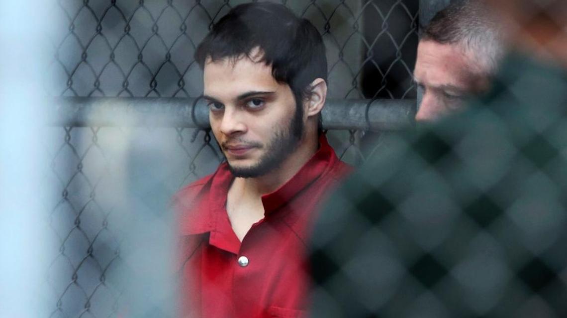 In this Jan. 9, 2017, photo, Esteban Santiago is taken from the Broward County main jail as he is transported to the federal courthouse in Fort Lauderdale.
