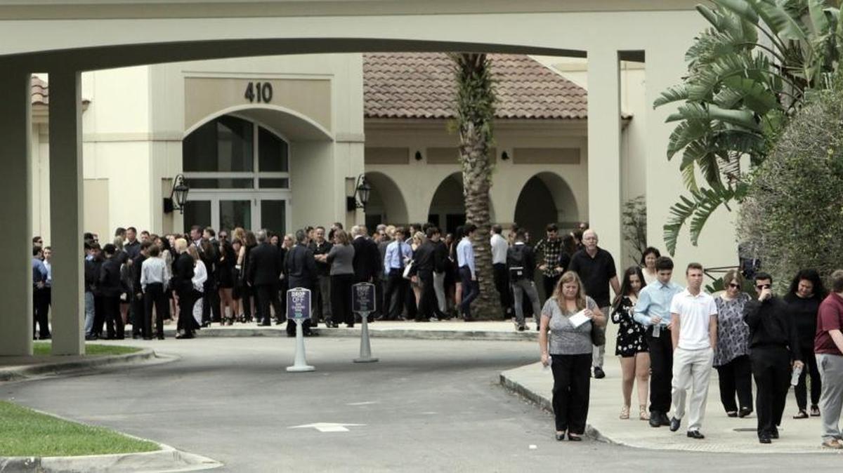Mourners leave the Church by the Glades in Coral Springs after funeral services for Luke Hoyer, one of the 17 victims of the Marjorie Stoneman Douglas HS shooting, on Feb 19, 2018.