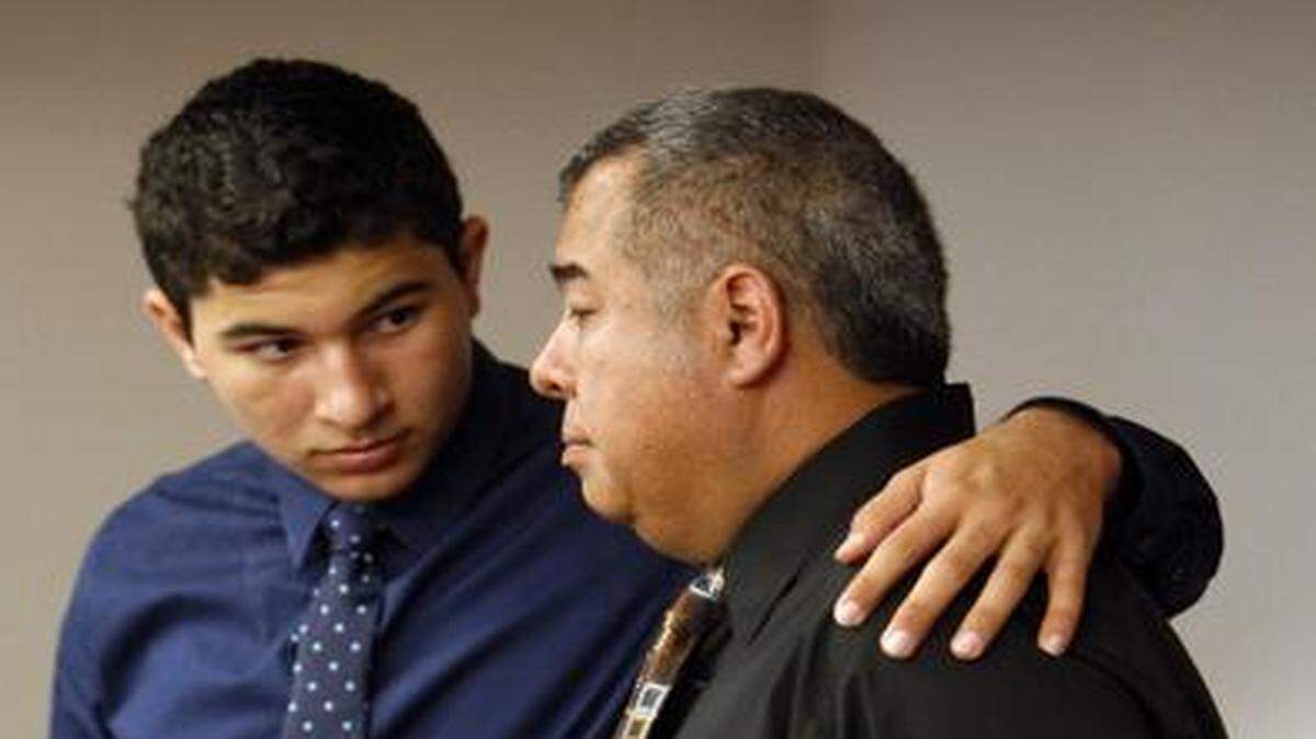 
 Mathew Bermudez puts his arm around his father, Carlos Bermudez, after Miami-Dade Circuit Judge Ronald Dresnick last year held the Miccosukee Tribe responsible for paying an outstanding $3.2 million judgment for the loss of their wife/mother Liliana Bermudez, who was killed in a 1998 car crash caused by a Miccosukee driver. That decision was later overturned by an appeals panel.
