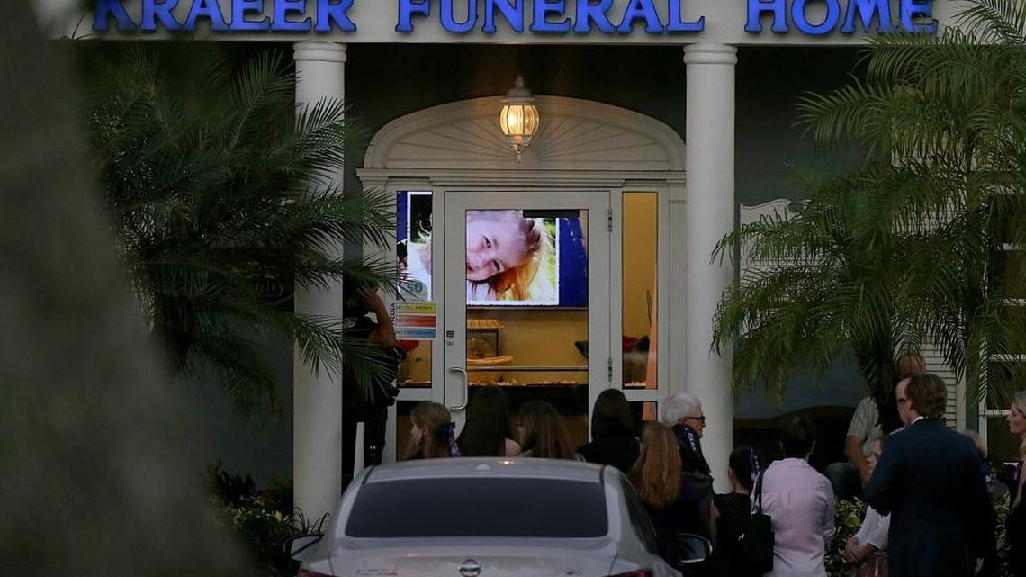 A picture of student Cara Loughran is projected on a screen as mourners lined up to enter a visitation for her at Kraeer Funeral Home on Thursday, February 22, 2018. She is one of the 17 victims from the shooting at Marjory Stoneman Douglas High School in Parkland, Florida.