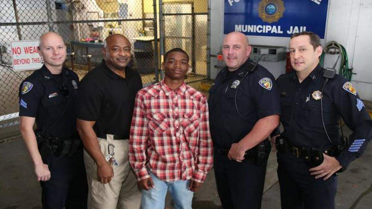 
From left to right: Officer Raymond Ketchmark, Officer Franklin Foulks, Jamal Rutledge, Officer Robert Norvis, Sergeant Todd Bunin
