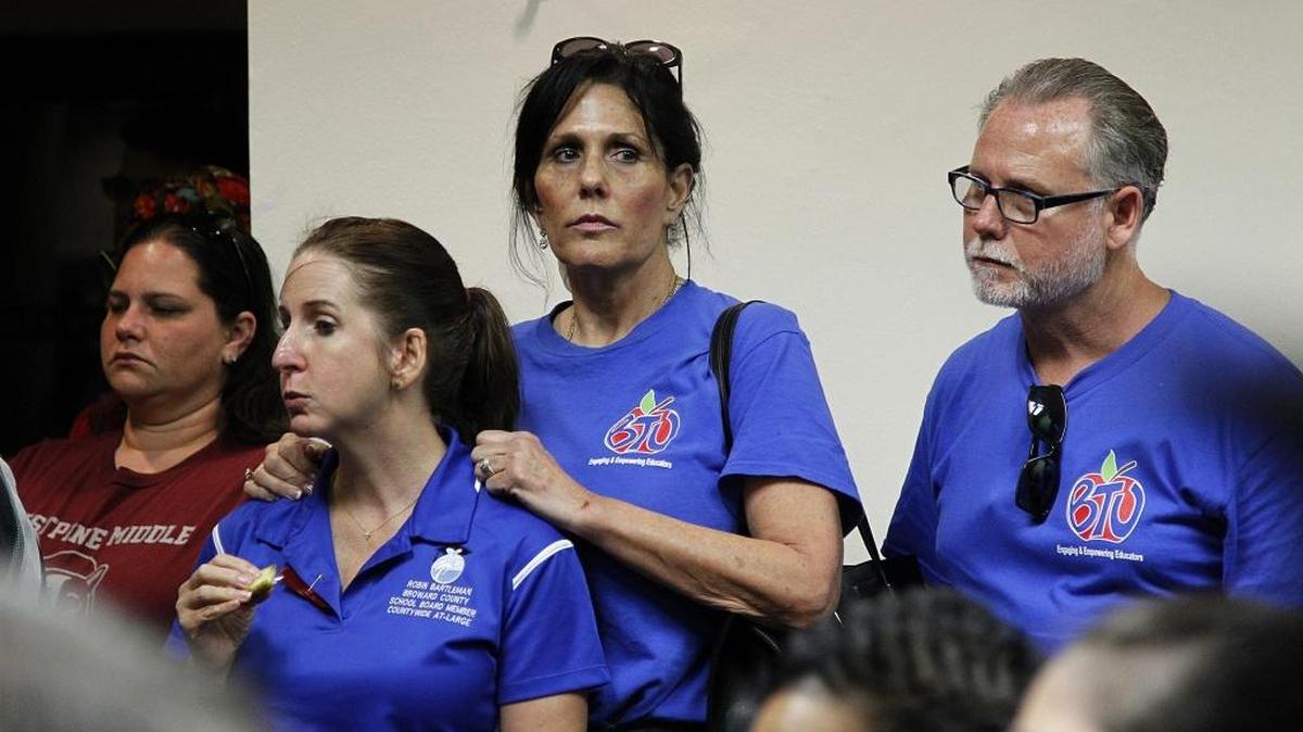 Broward School Board member Robin Bartleman, (second from left), with teachers at the Teachers Union building about the shooting at Marjory Stoneman Douglas High School in Parkland that left 17 people dead.
