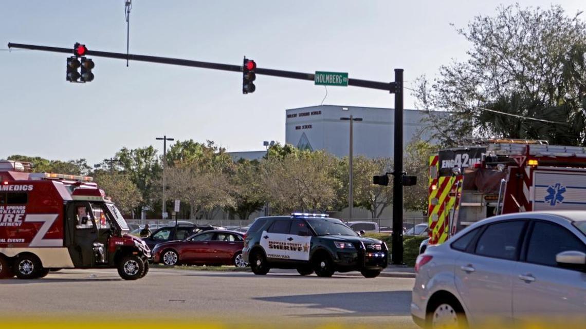 Police and fire rescue vehicles converge on Stoneman Douglas High School in Parkland after reports of an active shooter on Wednesday, Feb. 14, 2018.