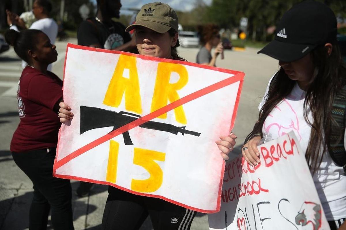 Deerfield Beach high school students arrive at Marjory Stoneman Douglas High School in Parkland after walking the 11 miles from school to school in support of the victims of the mass shooting.
