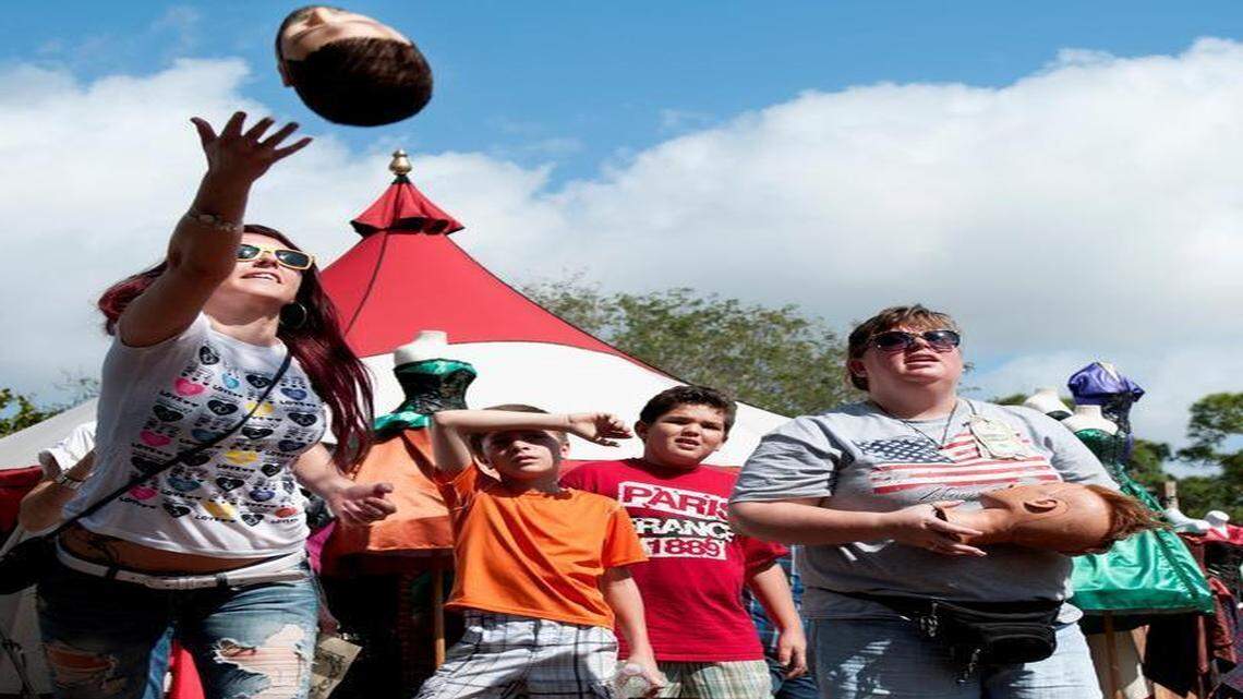 
Visitor of the Florida Renaissance Festival (left) throws a rubber head into the basket, on Sunday, February 22, 2015. The event started on Feb. 7, 2015, and will continue until March 15, 2015, at Quiet Waters Park in Deerfield Beach.
