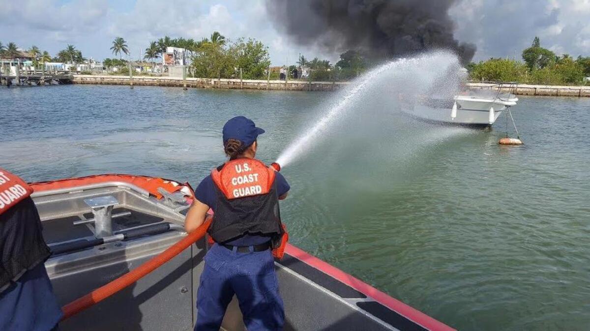 U.S. Coast Guard boats are equipped with pumps to help fight boat fires, like this one on June 15 in Marathon. No one was aboard.