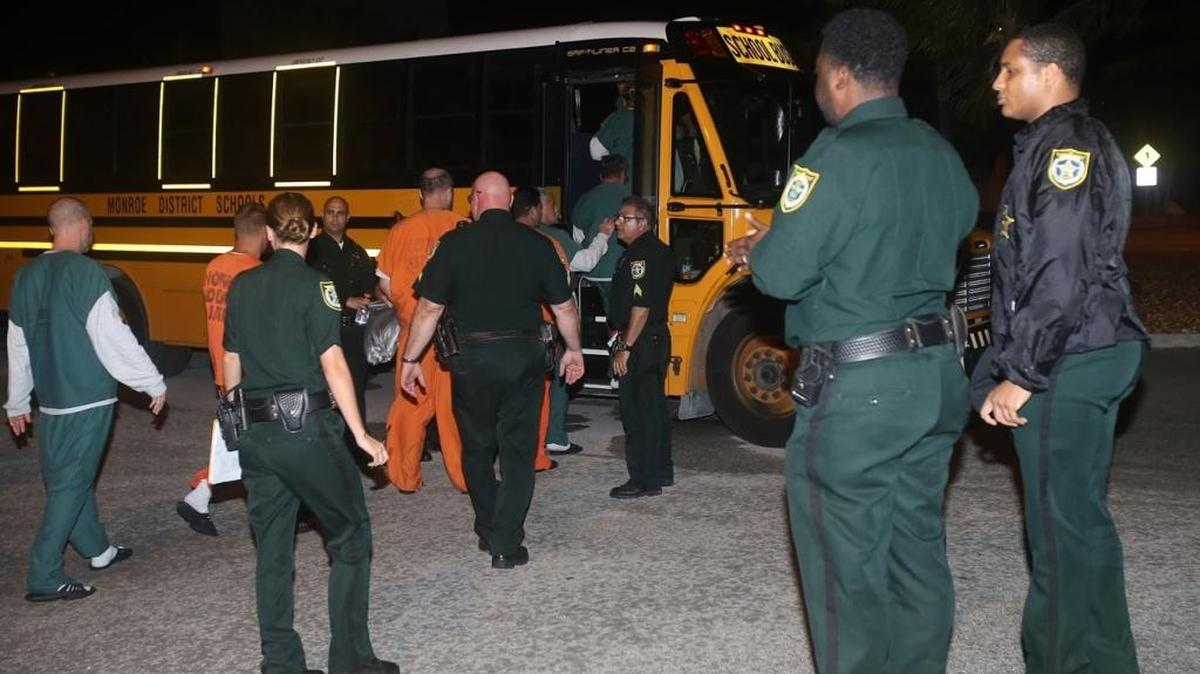 Monroe County Sheriff’s Office deputies keep watch on Stock Island jail inmates boarding a bus for evacuation to Palm Beach County before Hurricane Irma. Jail guards and other agency employees who did not report for duty are facing investigation and possible firing.