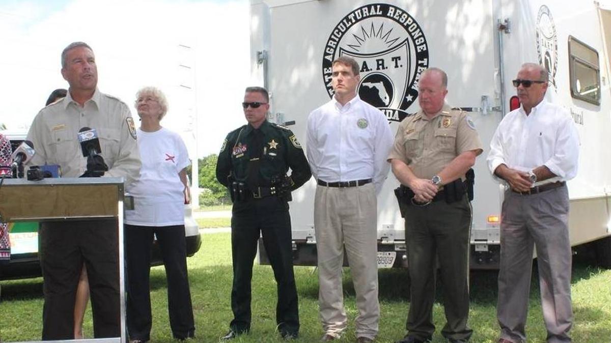 Dan Clark, manager of the National Key Deer Refuge on Big Pine Key, speaks at a press conference in Key Largo Monday about New World screwworms. With him are Monroe County and agriculture officials. This is at the animal-health checkpoint at mile marker 106.
