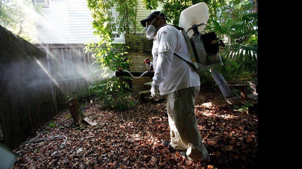 
A field inspector with the Florida Keys Mosquito Control District, tests a sprayer that could be used in the future to spray pesticides to control mosquitoes in Key West.
