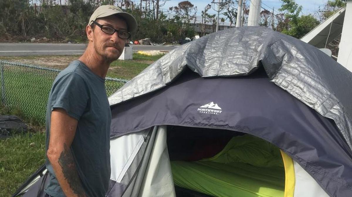 Scott Seaver stands outside the tent he’s been living in on Big Pine Key for more than two months.