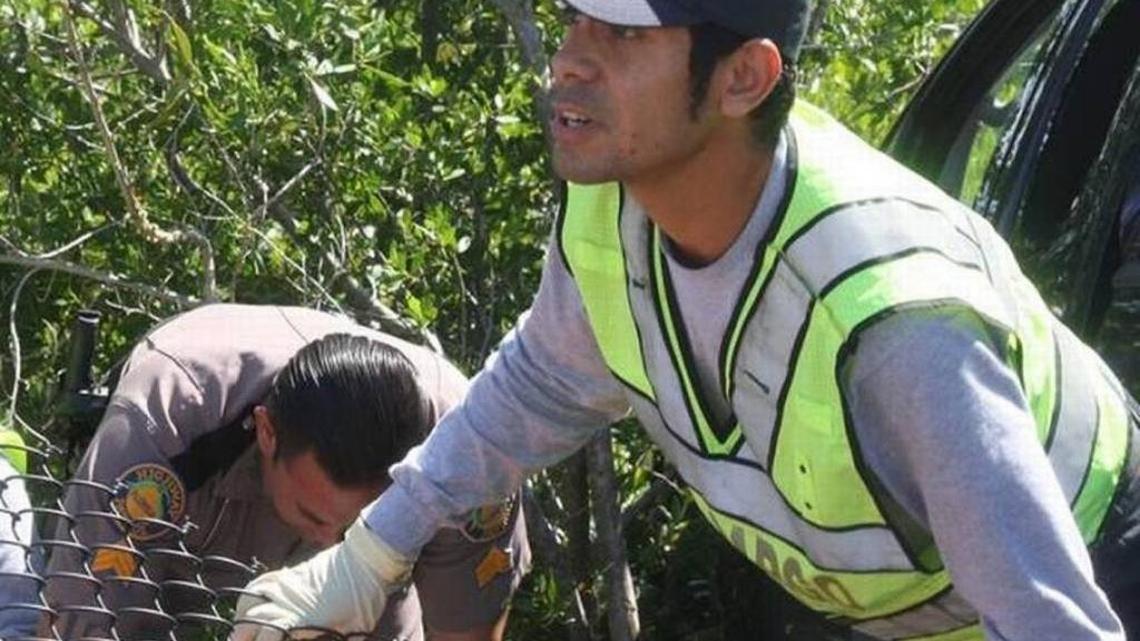 Key Largo Volunteer Fire Department firefighter Leonardo Moreno became seriously ill trying to save the lives of utility workers trapped in a drainage hole in Key Largo on Jan. 16. He is pictured here helping Florida Highway Patrol Sgt. Pedro Reinoso prepare a man suffering serious medical issues to board an ambulance on Aug. 5, 2015.