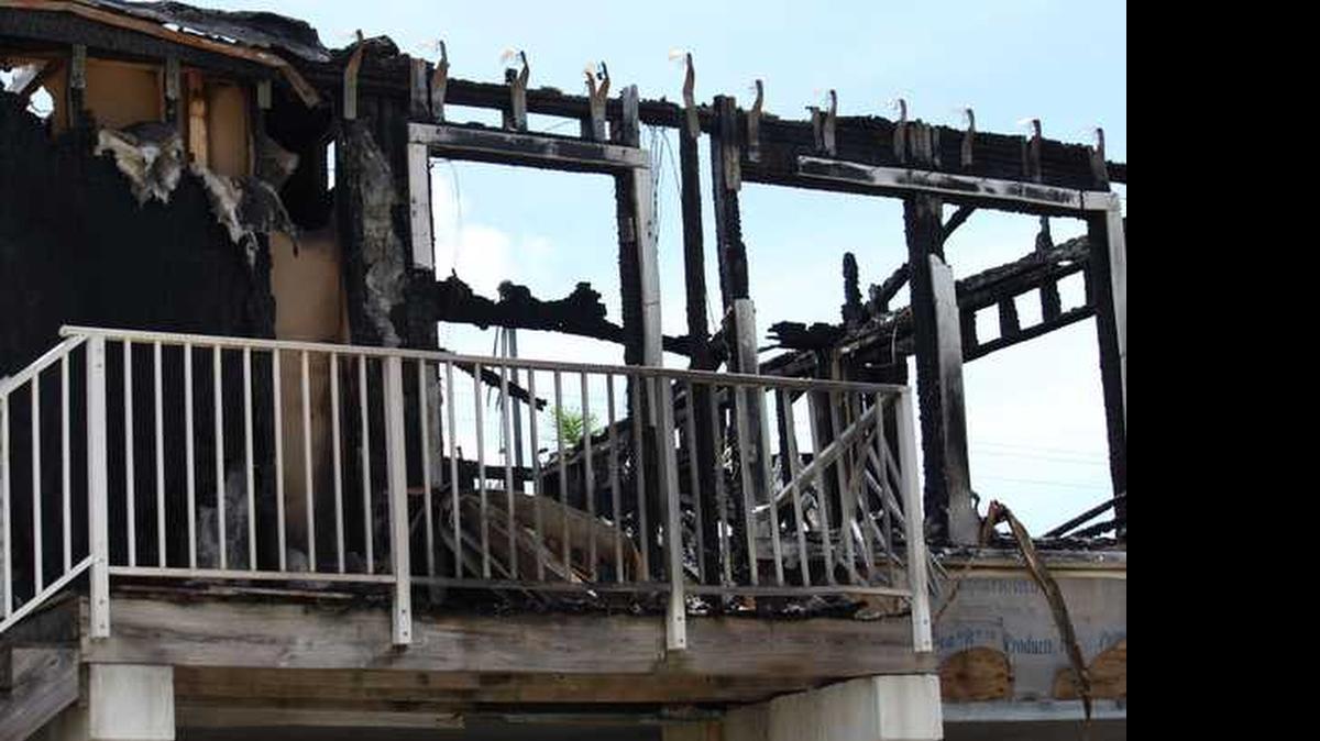 
A fire destroyed an Anguila Lane house Sunday morning, killing a mother and her two young children 
