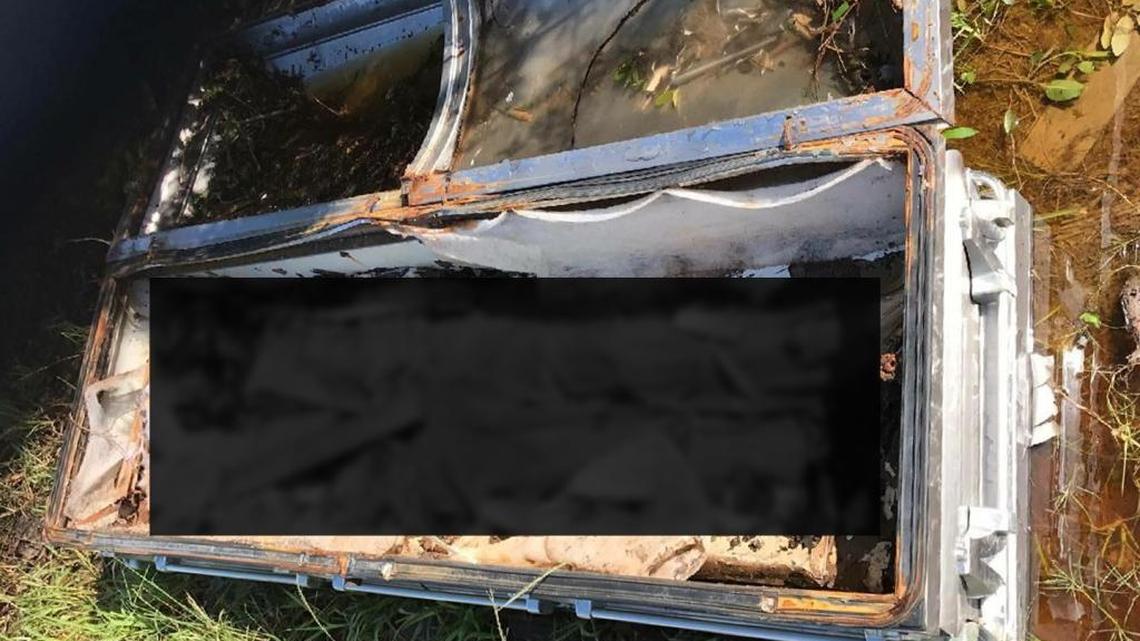 After Hurricane Irma hit Big Pine Key, a casket from a nearby cemetery wound up lifted by storm surge across the Overseas Highway, winding up along a neighborhood street. The top broke open, exposing the remains of a man in a baby blue suit. The casket, one of a handful displaced statewide by Irma, is now back in its proper resting place. Though the man was unidentified, The Herald has blacked out part of the photo out of respect to any family members.