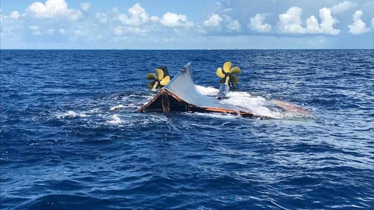The stern of a large boat is floating bottom up near Tennessee Reef Light off Long Key Sunday, Oct. 15. U.S. Coast Guard Station Islamorada is investigating what happened to the vessel and from where it originated.