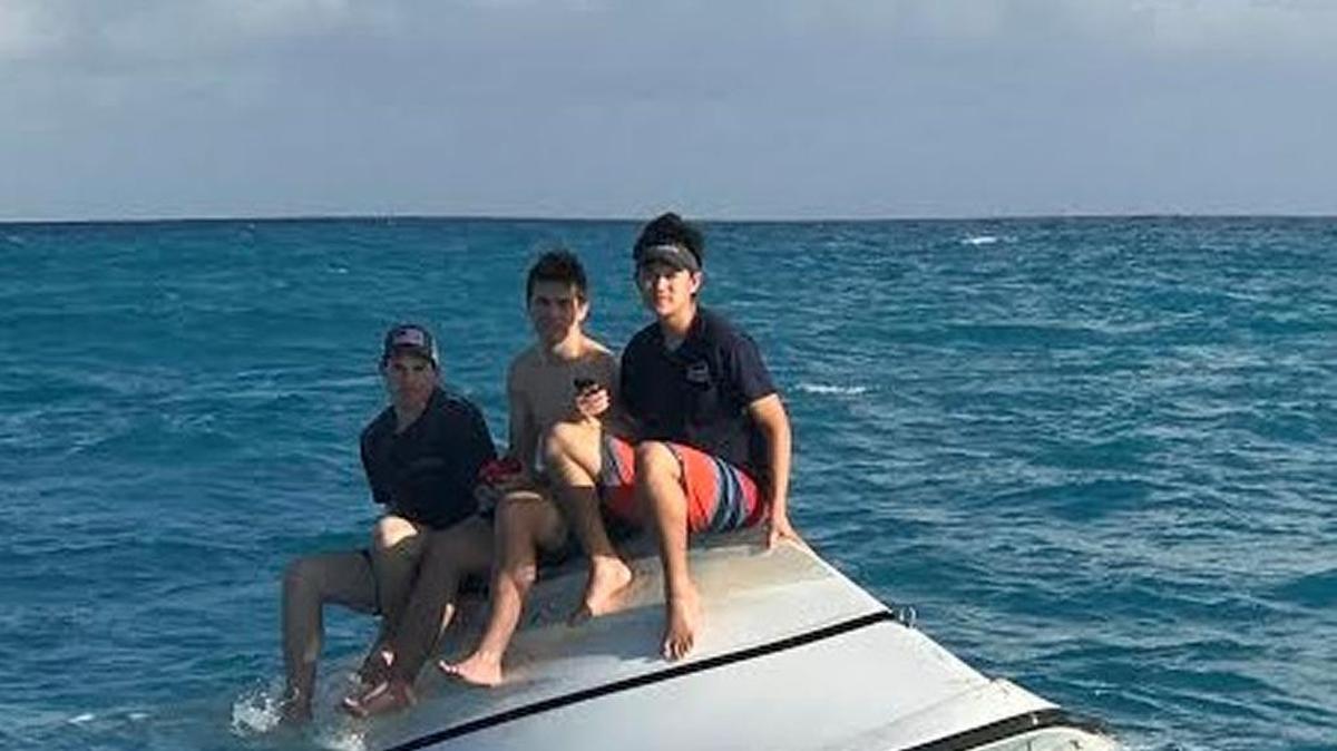 Three teenagers from Orange County, Calif., await rescue on their rented boat off Little Torch Key.