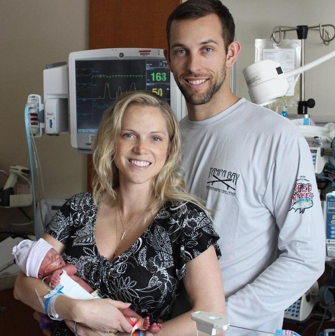Jessica and Austin Hammond, of Tampa, with their newly born daughter, Coral.