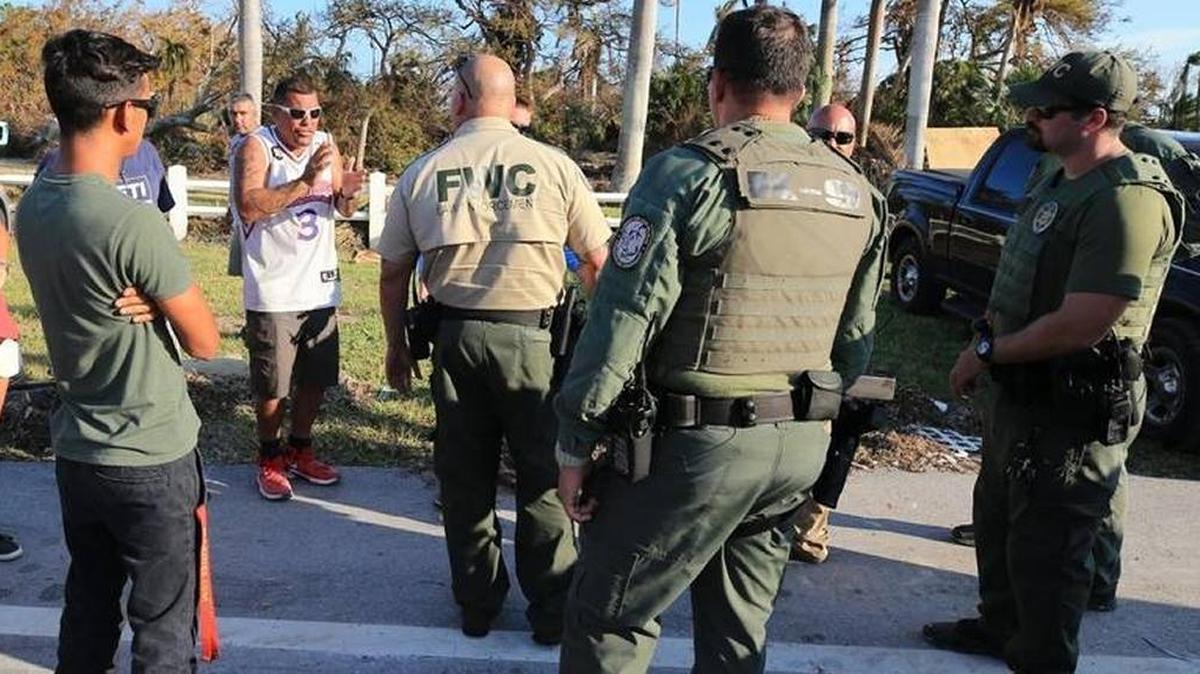 Police talk with Keys residents at a checkpoint at Mile Marker 73. Tensions flared at the Lower Matecumbe Key checkpoint, and one in Florida City, in the days immediately following Hurricane Irma in September.