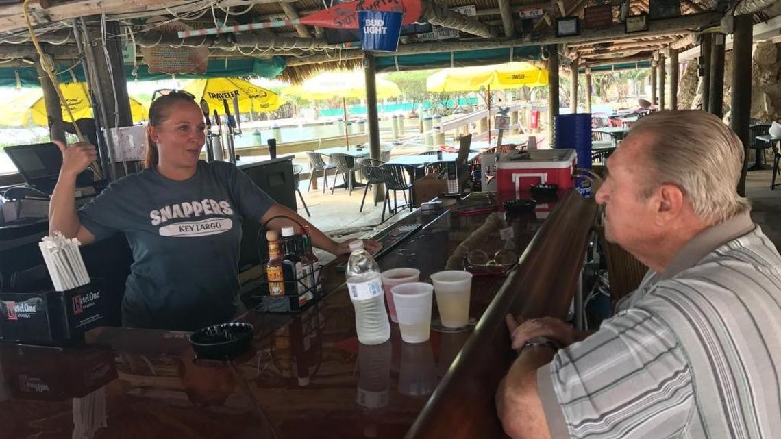 Snappers Oceanfront Restaurant and Bar bartender Danni Leboeuf chats with a customer on Friday, Oct. 20. The bar was rebuilt in the days after Hurricane Irma destroyed much of the property.