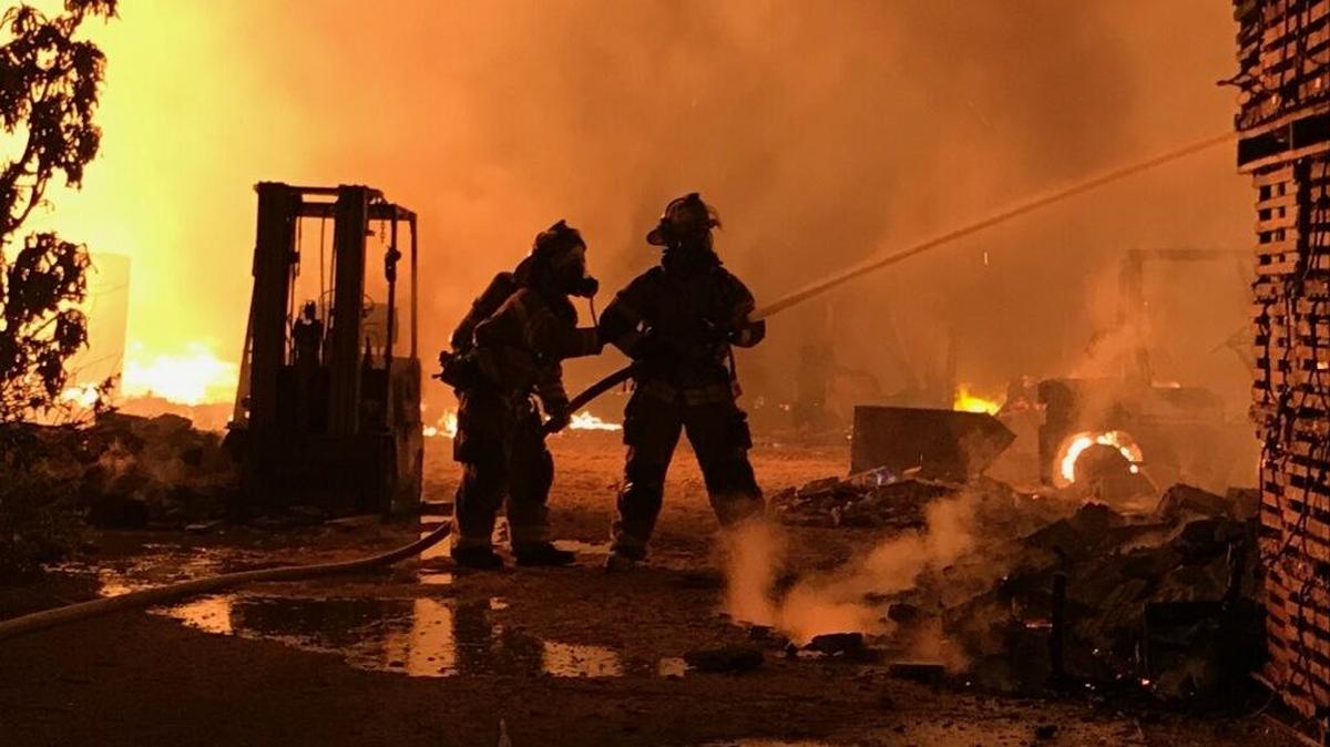 Monroe firefighters at the scene of a major marina blaze in Marathon early Monday.