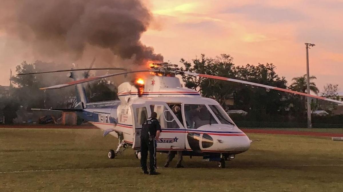 Smoke and flames billow out from beneath the rotors of one of Monroe County’s Trauma Star medical helicopters on the soccer field of Coral Shores High School in Plantation Key Friday morning.