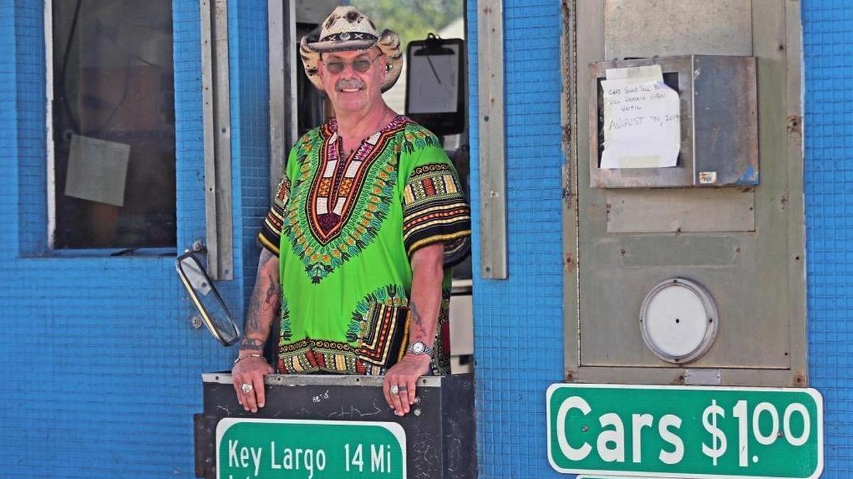 Toll booth collector Ken Murray, nicknamed 'Cowboy', on his last day of collecting tolls on Card Sound Road after working there after 25 years. The booth was one of the last manned tollbooths in Florida, Aug. 31, 2017.