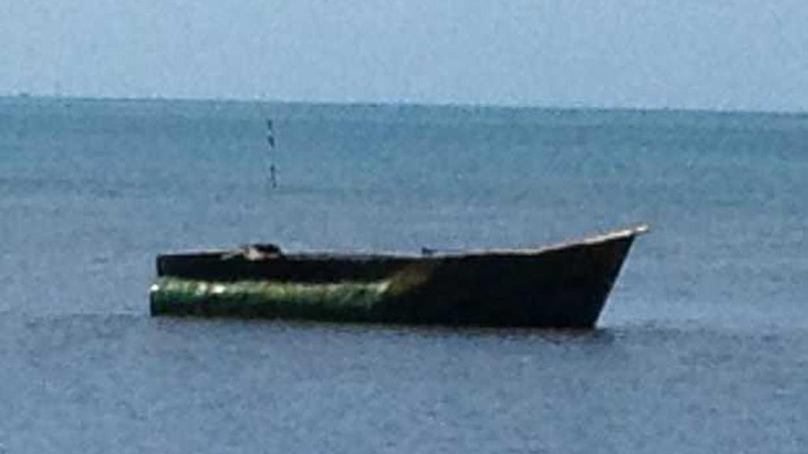 A makeshift vessel is moored offshore in Tavernier near mile marker 90. Eight Cuban men arrived in the boat on Wednesday morning.