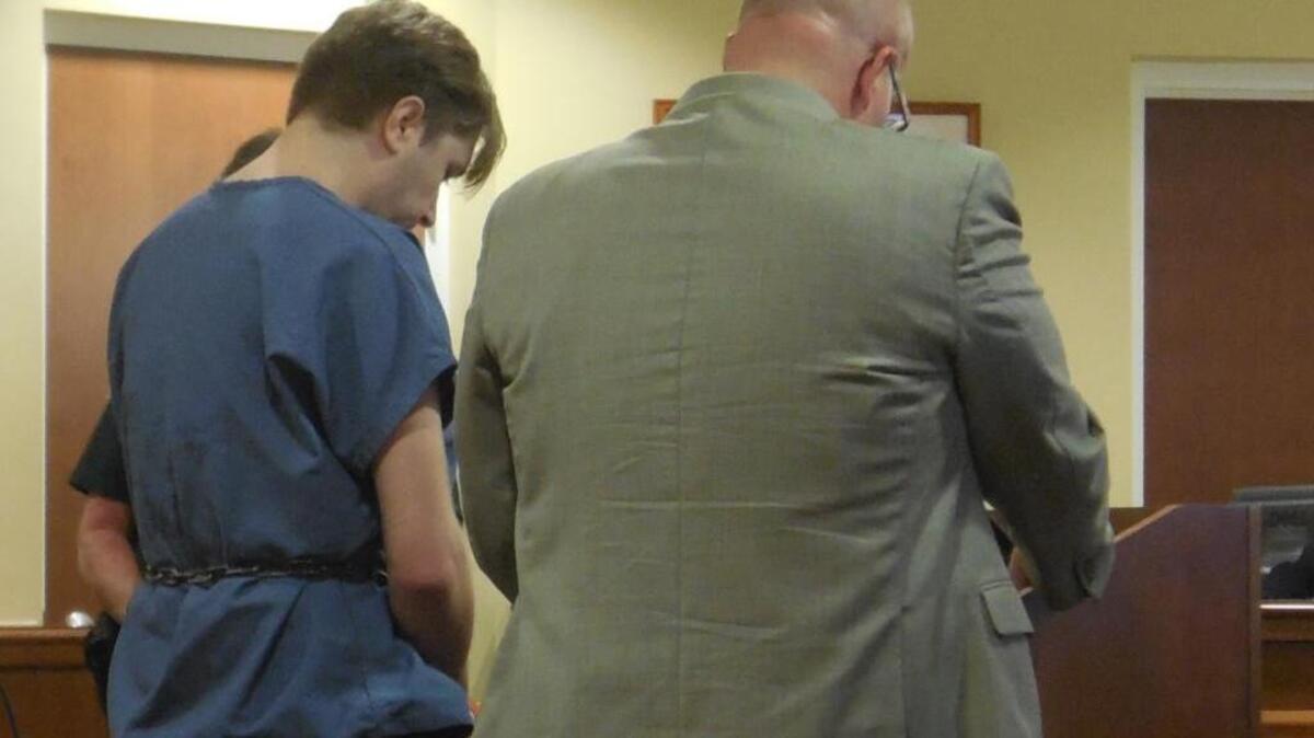 Stuart Collins stands before Judge Ruth Becker with his attorney, Hal Schuhmacher, at Monday’s sentencing.
