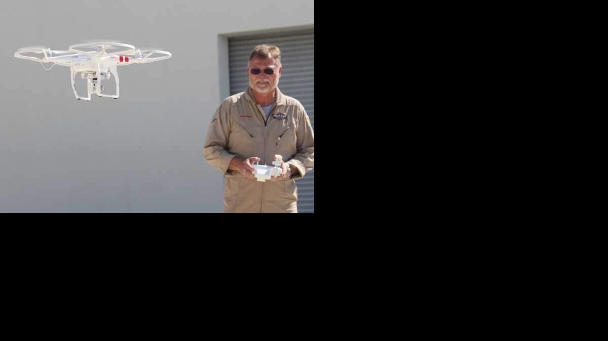 
Glenn Cullingford, chief pilot for the Florida Keys Mosquito Control District, operates a Phantom Vision 2+ quadcopter Thursday at the Marathon airport. The unmanned aerial system will be used to survey hard-to-reach places for potential mosquito breeding grounds.
