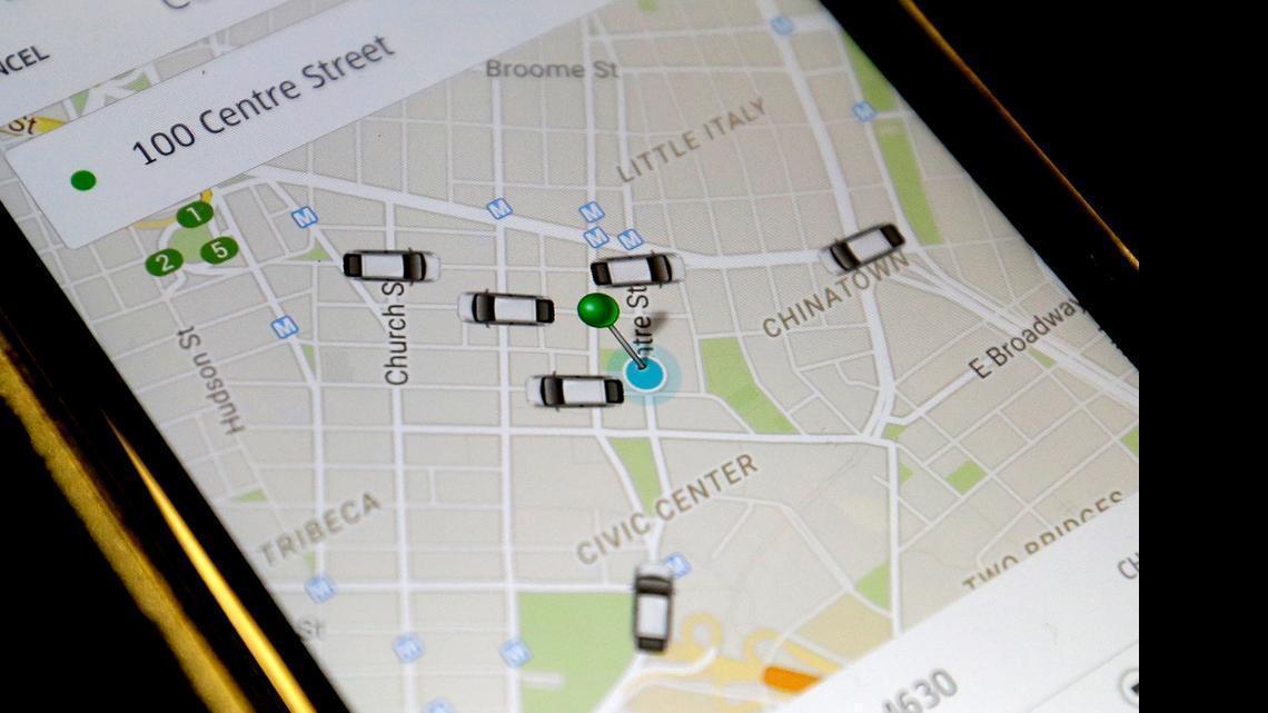 
In this Wednesday, March 18, 2015, file photo, the Uber app displays cars available to make pickups.
