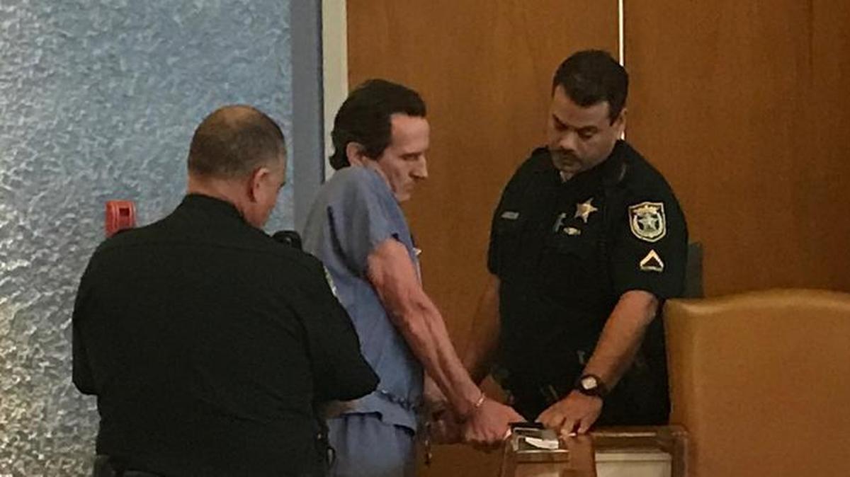 Monroe County Sheriff’s Office deputies take fingerprints from a shackled Robert Schminky on Tuesday, March 20, after Circuit Judge Luis Garcia sentenced him to two life terms for his 2015 shootout with deputies and a Florida Highway Patrol trooper.
