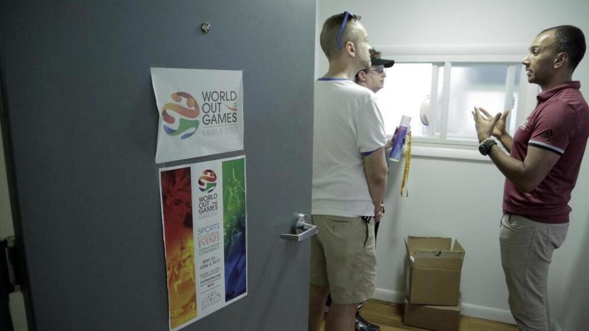 World OutGames Miami CEO Ivan Cano, right, talks to disappointed athletes on May 26 at the event’s offices on Washington Avenue in Miami Beach, hours after most of the sporting events were canceled. Miami Beach police announced on Wednesday that organizers will not face criminal charges in the OutGames fiasco.