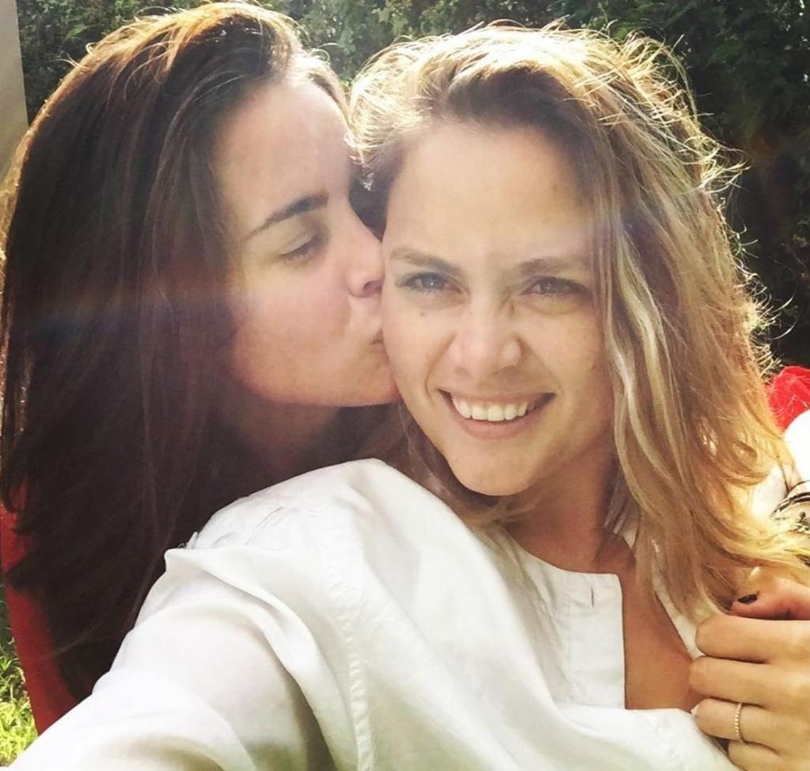 First-grade teacher Jocelyn Morffi (left) with her wife, Natasha Hass. Morffi was fired from her job at a Miami Catholic school days after the couple married.