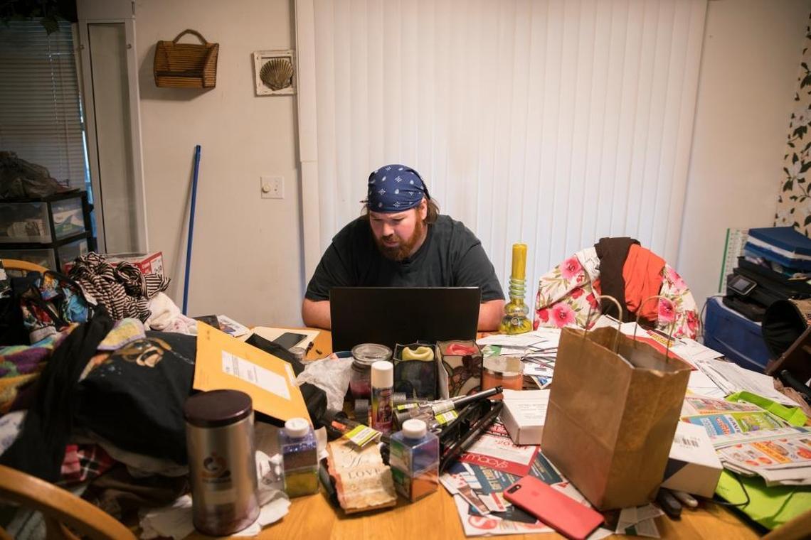 Christopher Hansen sits at his kitchen table and messages with Jose ‘Junior’ Martinez, a survivor Hansen is credited with saving the night of the shooting at Pulse. Hansen had been looking for him on Facebook for weeks before the social media community was able to connect them.