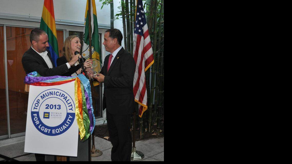 
Businessman Thomas Barker and Whitney Lovell of HRC in April present Miami Beach Mayor Philip Levine with award celebrating the city’s 2013 Municipal Equality Index ranking.

