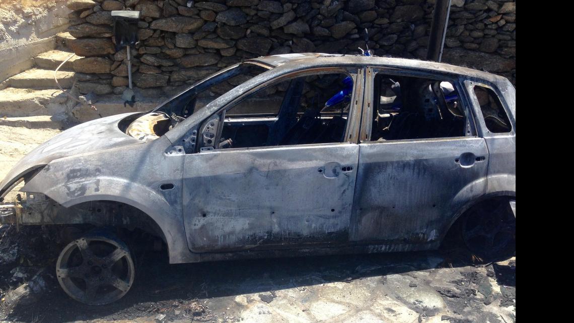 
James Davis — AKA Miami drag queen Elaine Lancaster — pulled an Italian man from inside this automobile that caught fire early Friday in Mykonos, Greece.

