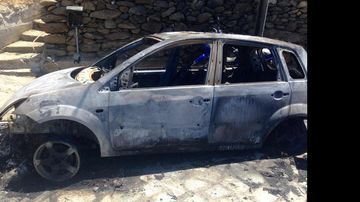 
James Davis — AKA Miami drag queen Elaine Lancaster — pulled an Italian man from inside this automobile that caught fire early Friday in Mykonos, Greece.

